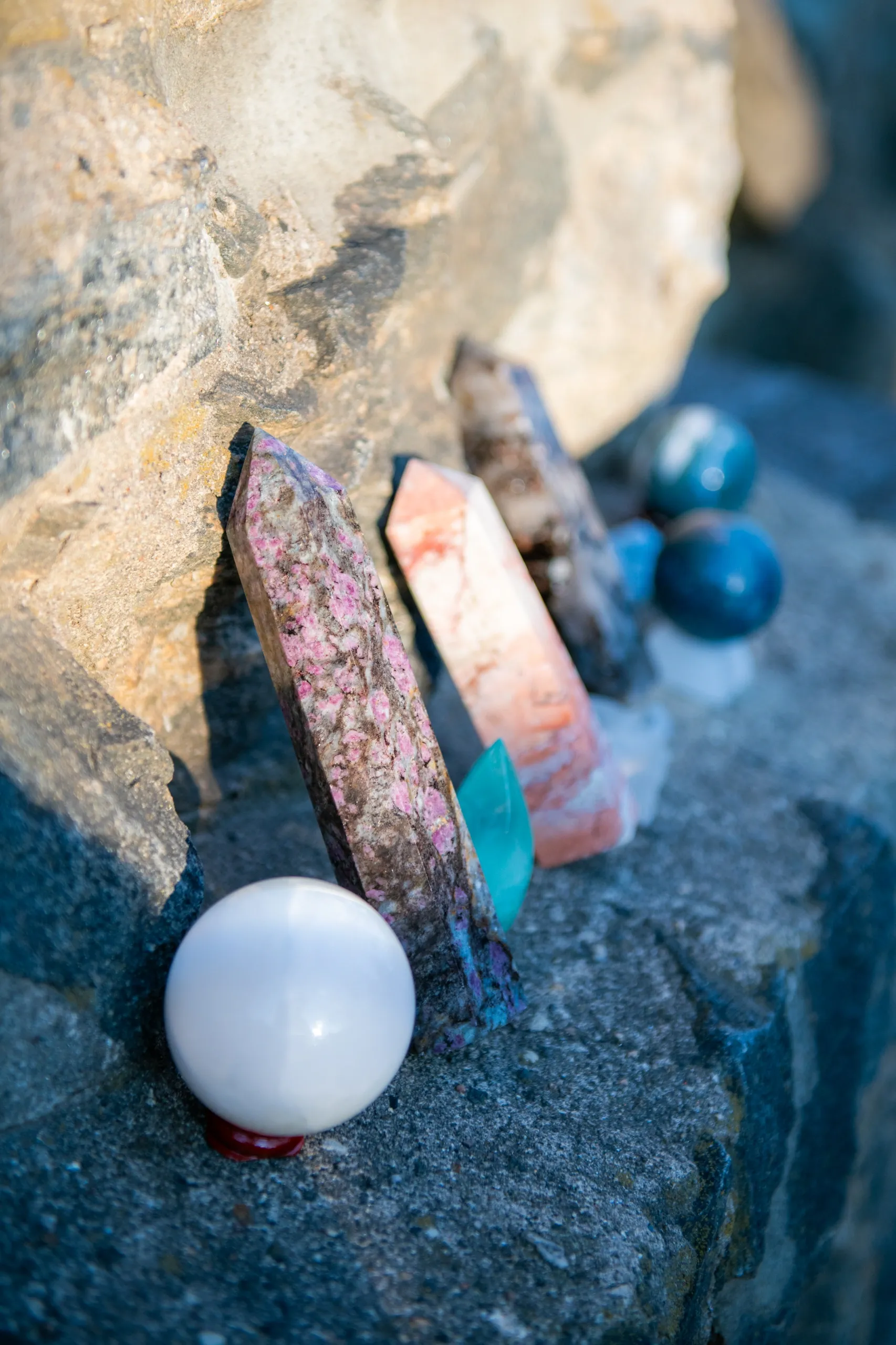 Crystals arranged for Reiki healing and energy balancing on a natural stone surface